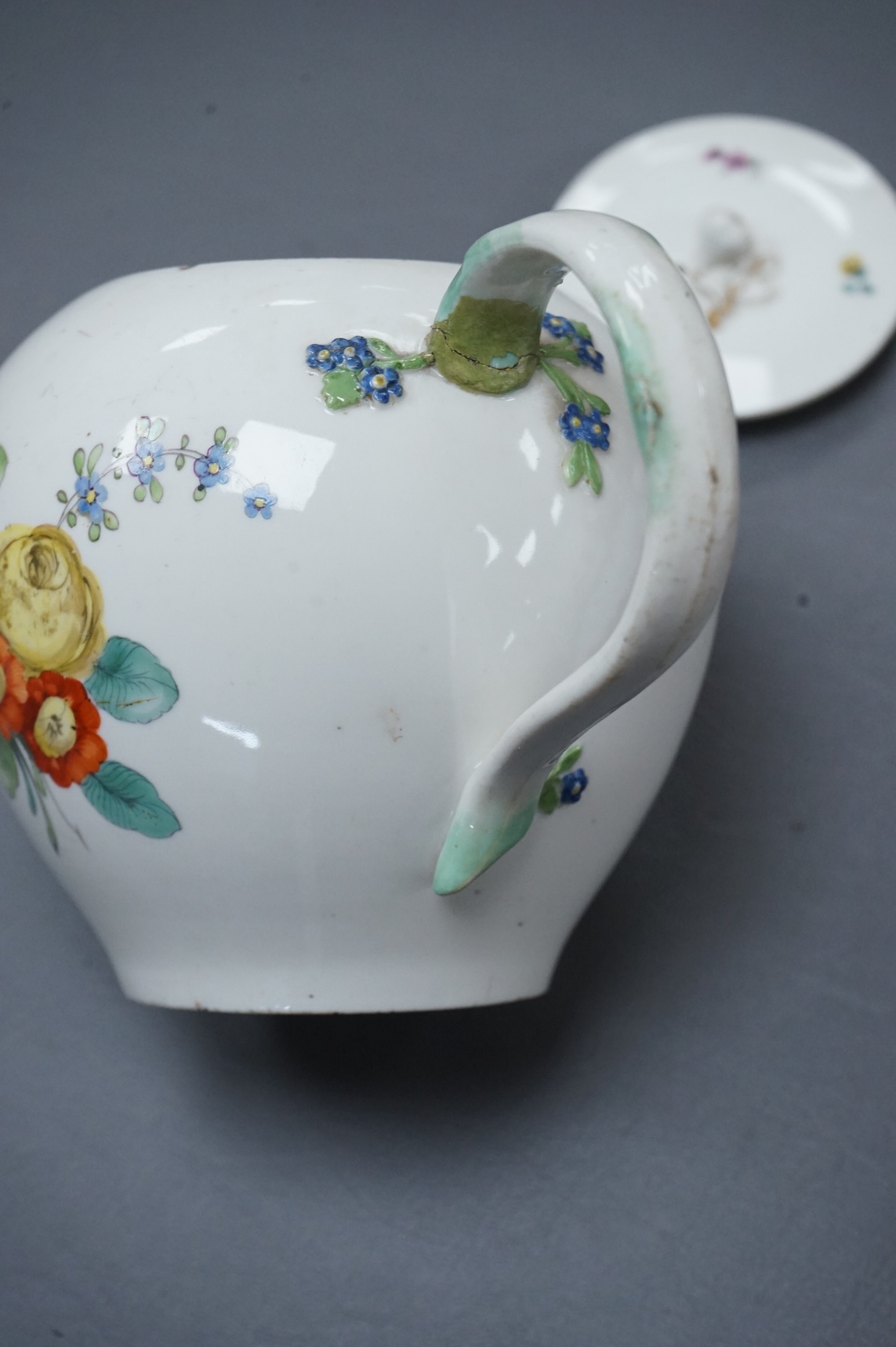The Hague, a late 18th century soft paste porcelain teapot, painted with polychrome flowers, 12cm high